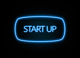 Start Up  - colorful Neon Sign on brickwall