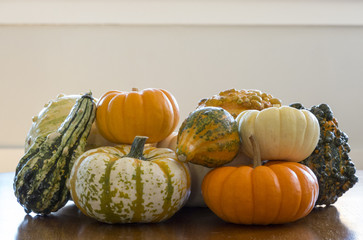 Group of gourds on a wood table with white background