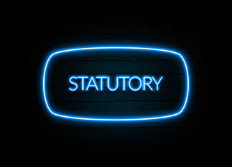 Statutory  - colorful Neon Sign on brickwall