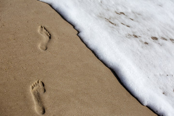footprints on the beach