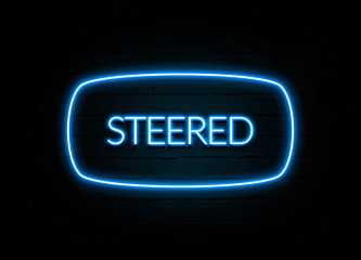 Steered  - colorful Neon Sign on brickwall
