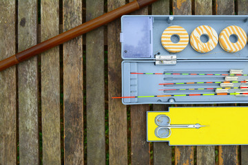 the classic fishing buoy in the box on wood table