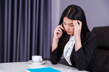 woman in business suit working in stress desperate talking on mobile phone