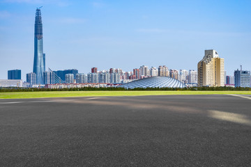 Fototapeta na wymiar urban traffic road with cityscape in background in Tianjin, China.