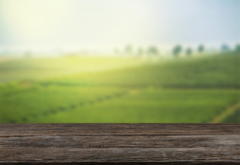 Empty wooden table with view of mountain or wooden desk with plantation nature with bokeh...