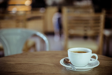 Coffee cup in coffee shop - vintage style effect picture