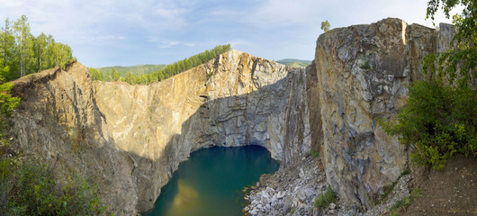 Panorama of the canyon formed by the collapse of the rock and filling with underground waters. Once it was a place of extraction of useful excavated.