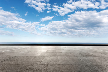 empty marble floor with beautiful sea in blue cloud sky