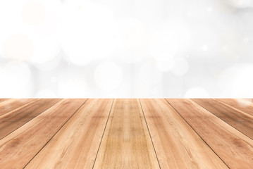 Wood table top on gleam shiny white bokeh abstract background