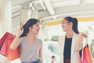 Happiness smiling young women with shopping bags