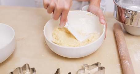 Mixing dough in bowl for making cookies