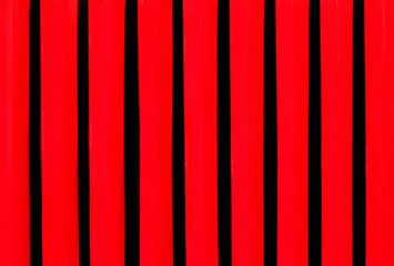 Grid grille in the hood of vintage car close up.Red black metal background - Powered by Adobe