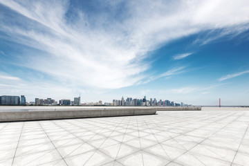 Obraz premium empty marble floor with modern bridge and buildings