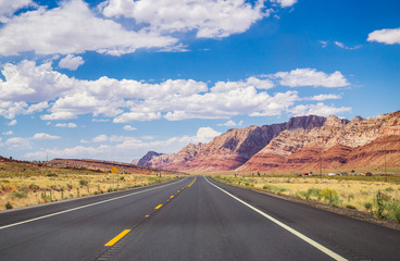 Picturesque road in Arizona. red stone cliffs and blue sky