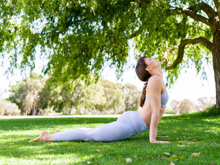 Young woman practicing yoga in the park