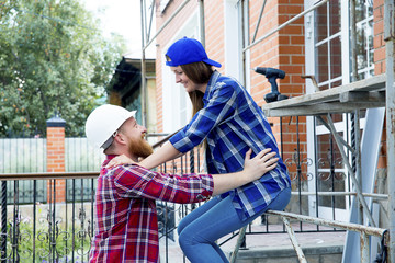 Couple building a house