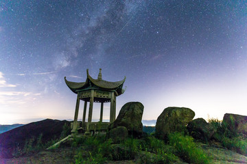 Naklejka premium stone pavilion on rocky hill