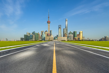Fototapeta na wymiar city road through the cityscape and skyline of shanghai