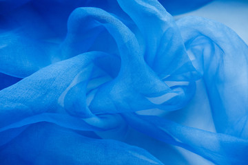 Light blue chiffon fabric for background.