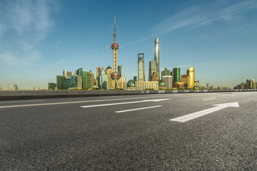urban traffic road with cityscape in background in Shanghai, China..