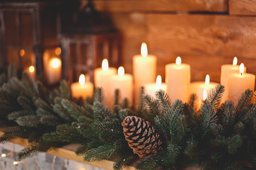 Burning candles in the New Year's interior with a Christmas tree