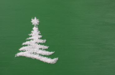 Tree of snow on the green wooden background