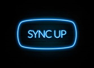 Sync Up  - colorful Neon Sign on brickwall