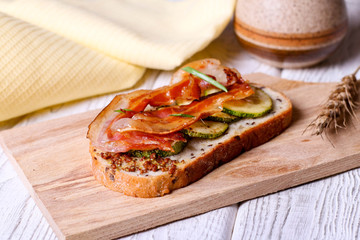 Bread with smoked bacon and zucchini