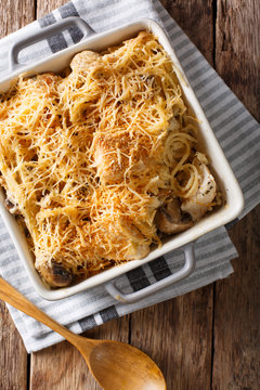North American tetrazzini with chicken close-up in a baking dish. Vertical top view