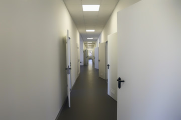 Long empty dormitory corridor with vintage style.