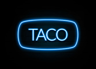 Taco  - colorful Neon Sign on brickwall