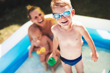 Picture of happy family in swimming pool