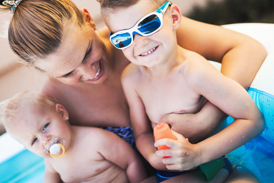 Picture of happy family in swimming pool