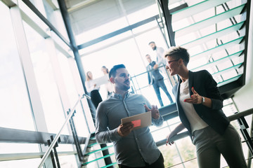 Picture of architects talking about project in hall