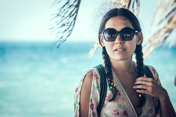 Portrait young woman on sea background