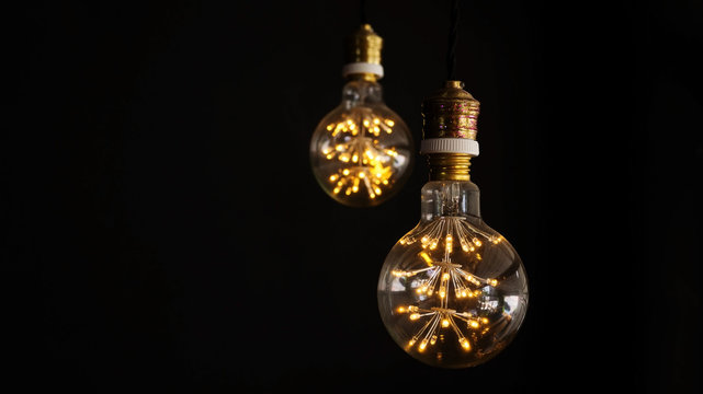 Light bulb on a black background.