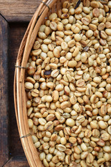 Close up of coffee beans on wooden background