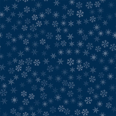 abstract seamless pattern made of snowflakes on blue. Christmas background for design of posters, postcards, invitation for the new year.