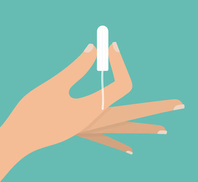 Woman's Hand Holding A Tampon