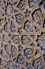 An old wood door with metal handle. Details of Muslim architecture.