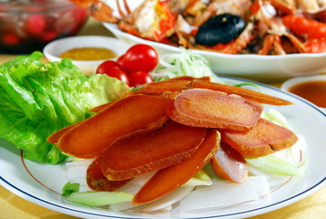 Slices of mullet roe on the white plate