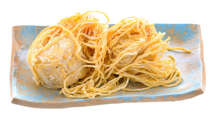 Yellow noodles isolated on white background.