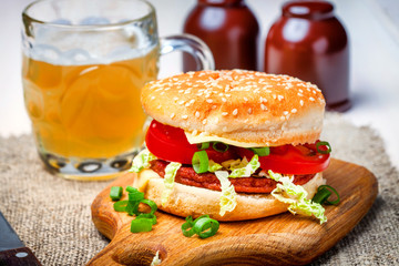 Homemade hamburger with fresh vegetables.
