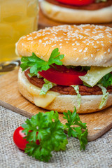 Homemade hamburger with fresh vegetables.