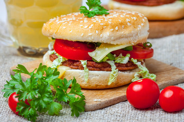 Homemade hamburger with fresh vegetables.