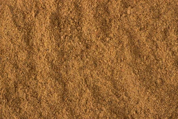 Plexiglas foto achterwand ground nutmeg powder spice as a background, natural seasoning texture © dmitr1ch