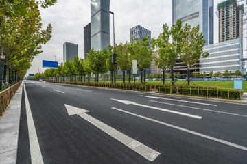 asphalt road through the modern city skyline