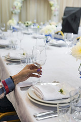the woman is holding a glass in her hand