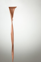 Melted hot chocolate syrup is dripping. Streams with drops isolated on gray