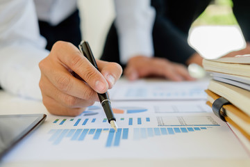 Start up partners are working in casual clothes  discussing the ideas for new strategy of development.